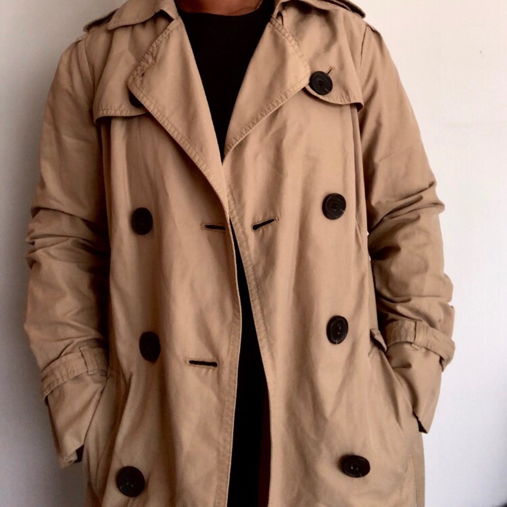 Tan/brown trench coat.